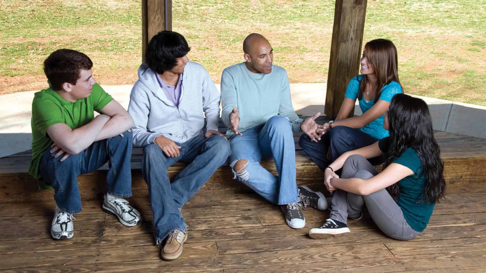 Group sitting on floor chatting